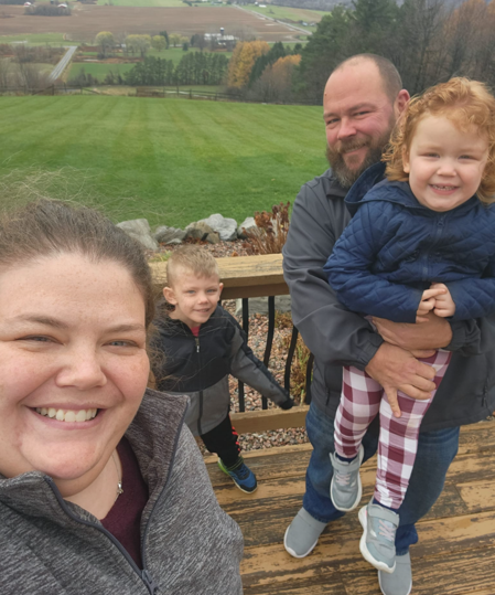 Tasha Haynes with her family outdoors.