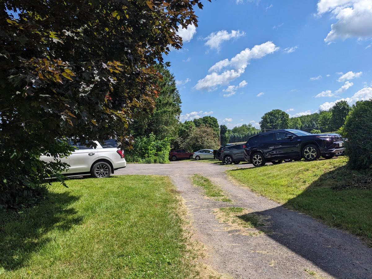 Vehicles gathered along the drive in the Brookside Area on an event day.