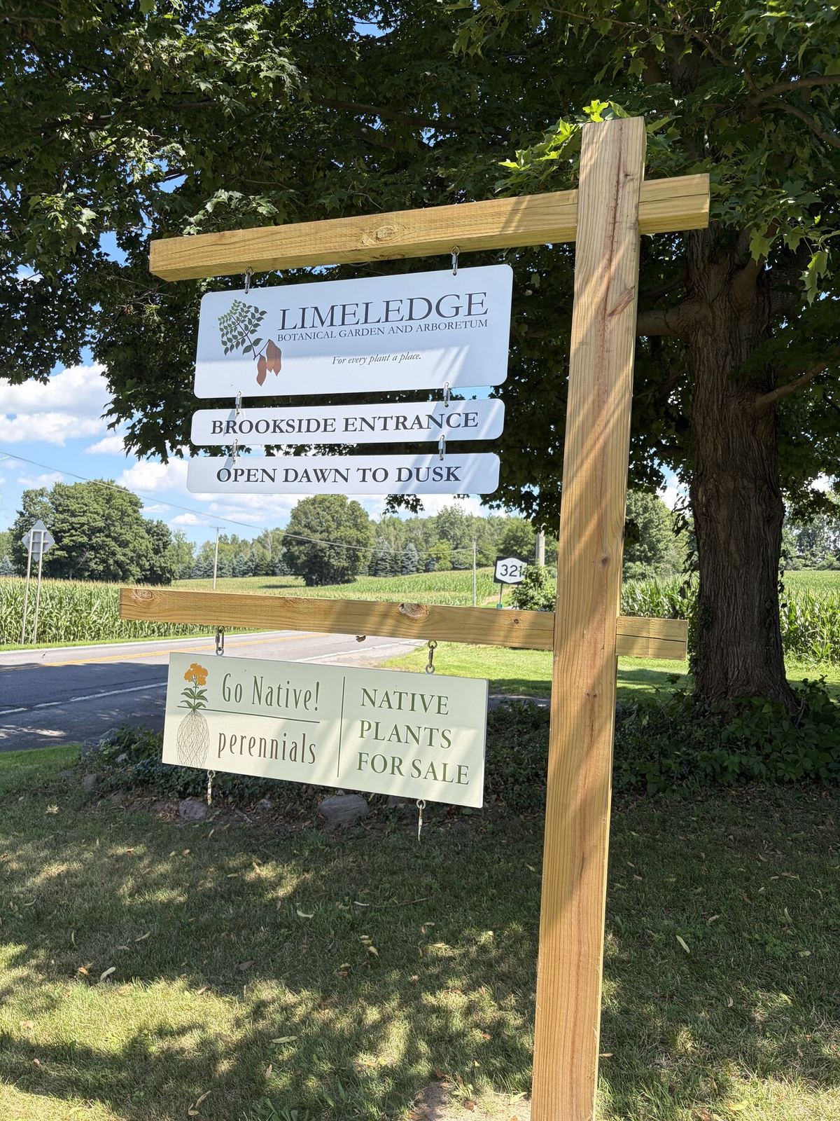 The Limeledge Brookside Entrance sign beside the road.